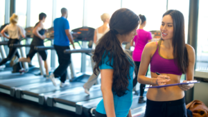 two women at gym talking about gym plan